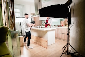 Before and after comparison of a kitchen photo enhanced with digital staging and lighting.
