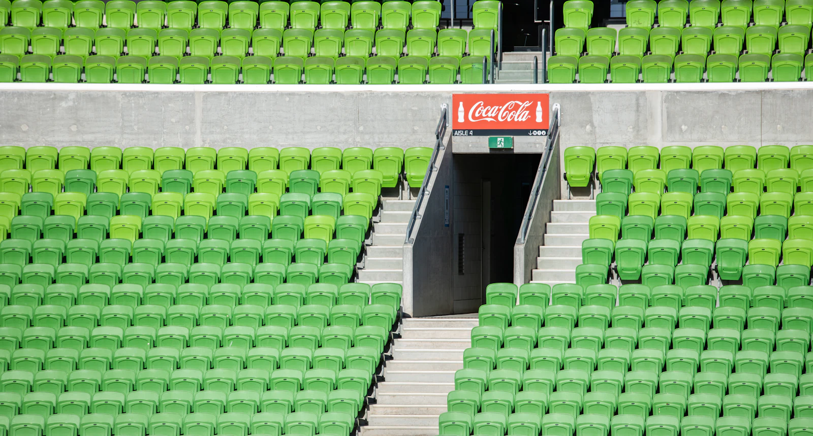 Rows of empty green and white stadium seats, illustrating stable rankings with fewer clicks after AI Overviews