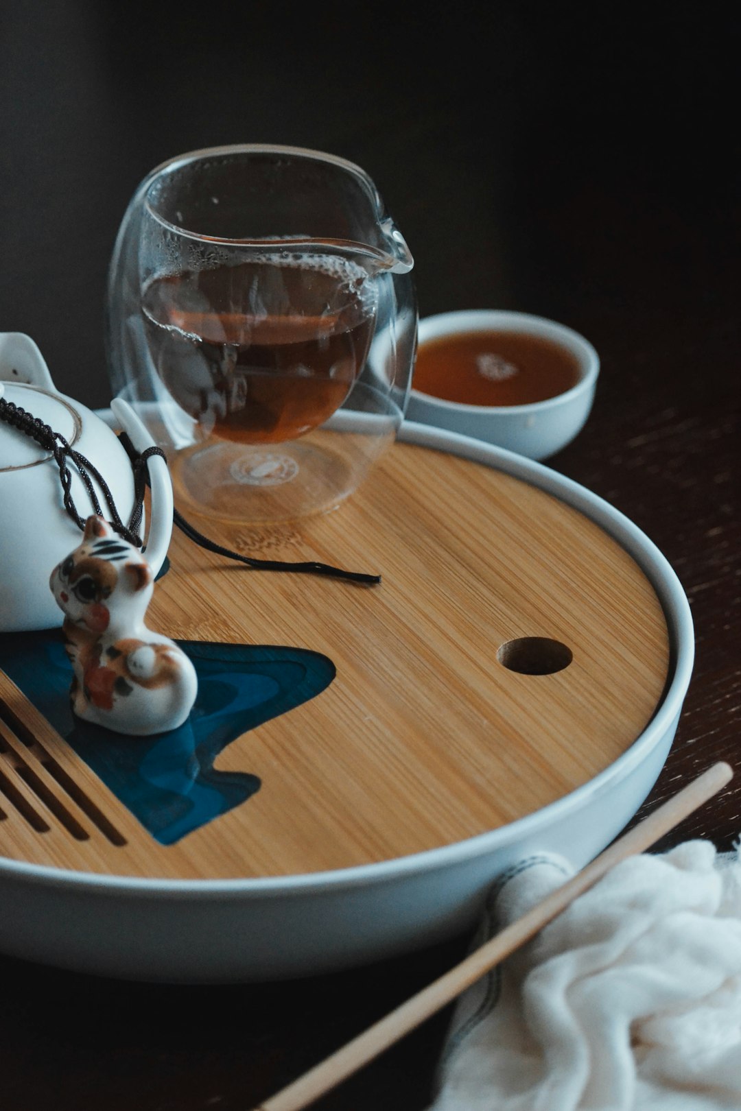 clear glass pitcher on brown wooden table