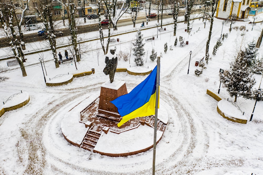 blue and yellow flag on brown wooden table