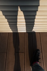 person wearing black leather shoes