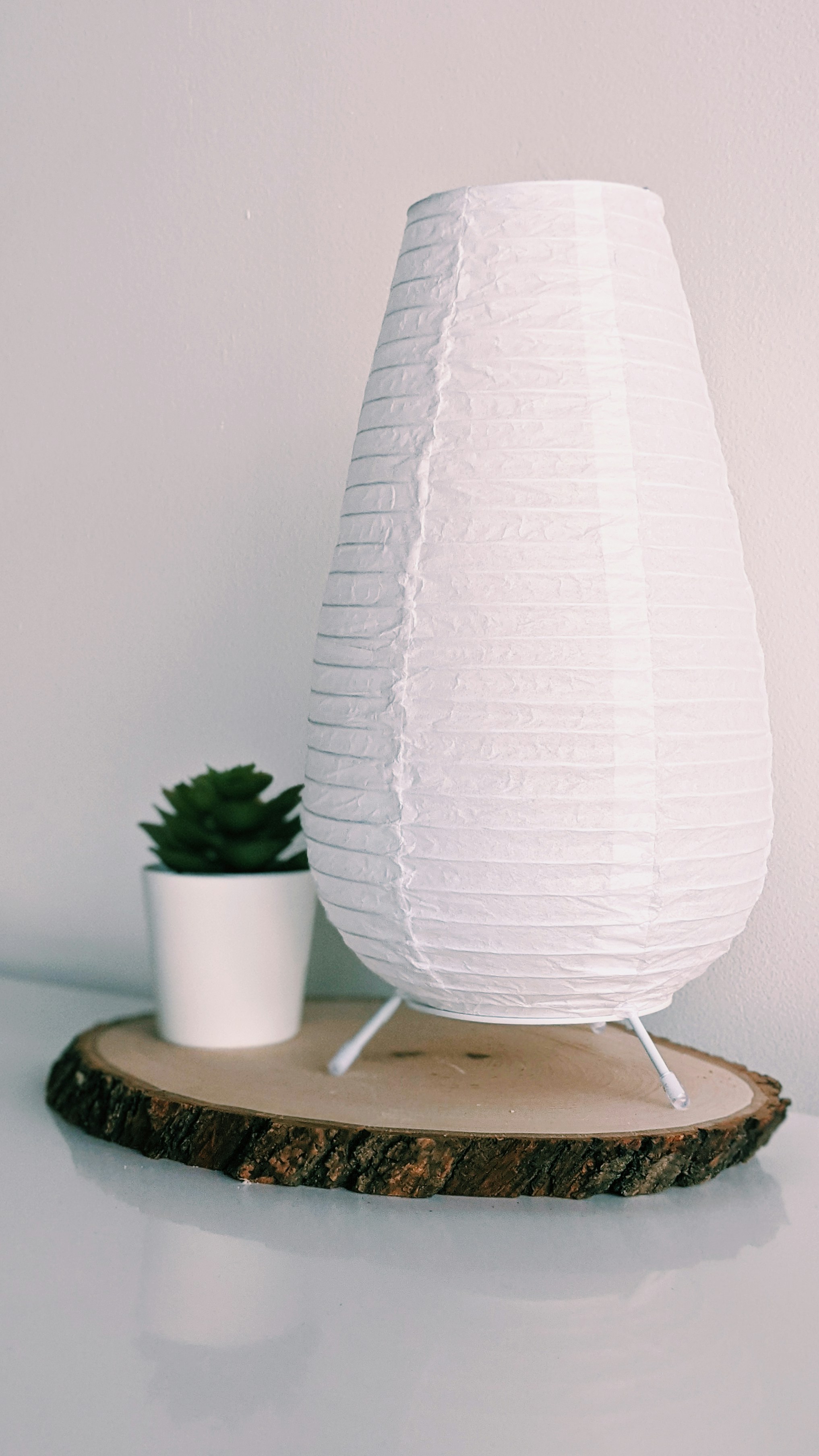 white round lamp on white round table