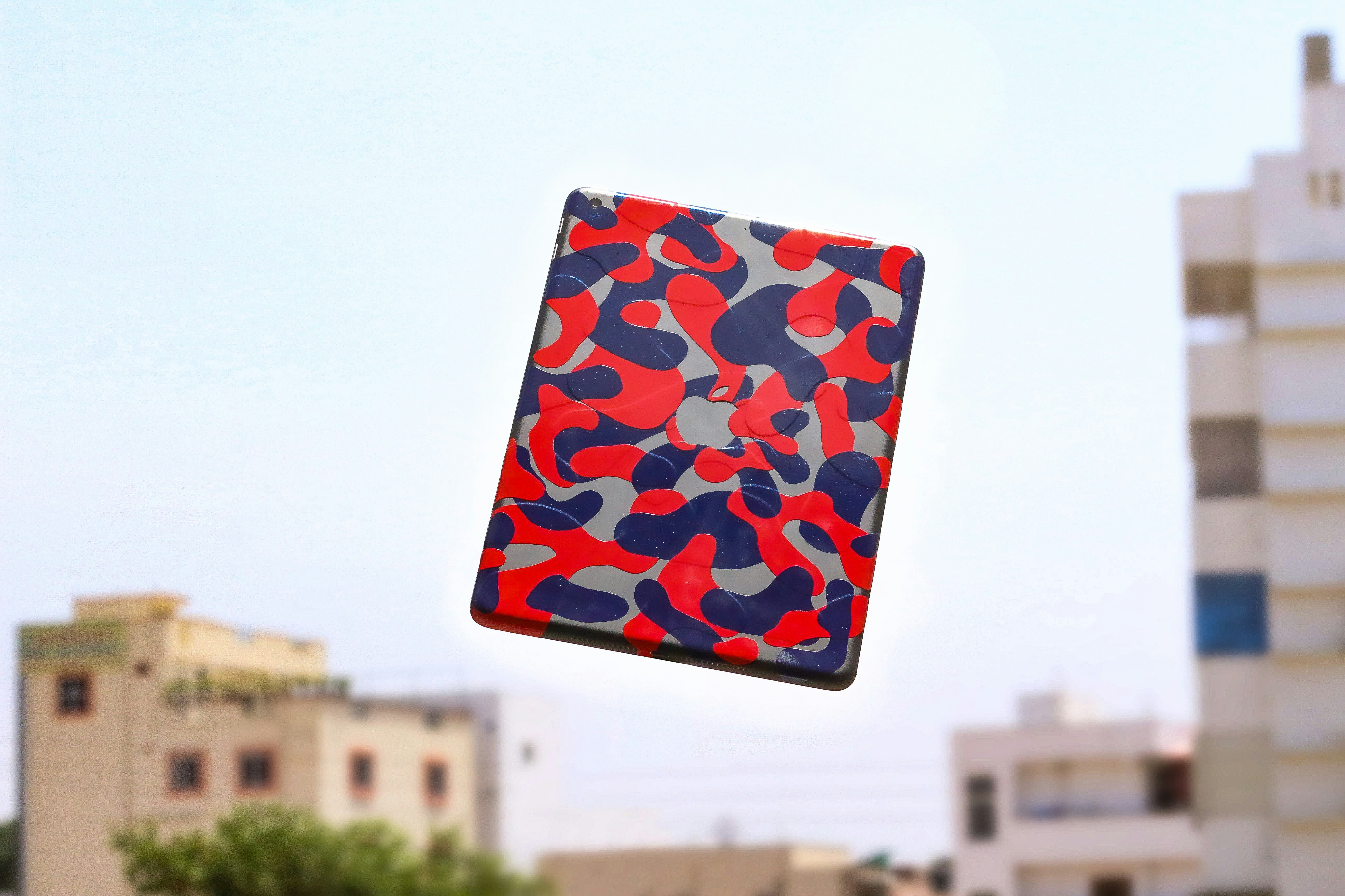 black white and red floral textile