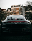 black porsche 911 parked on street during daytime