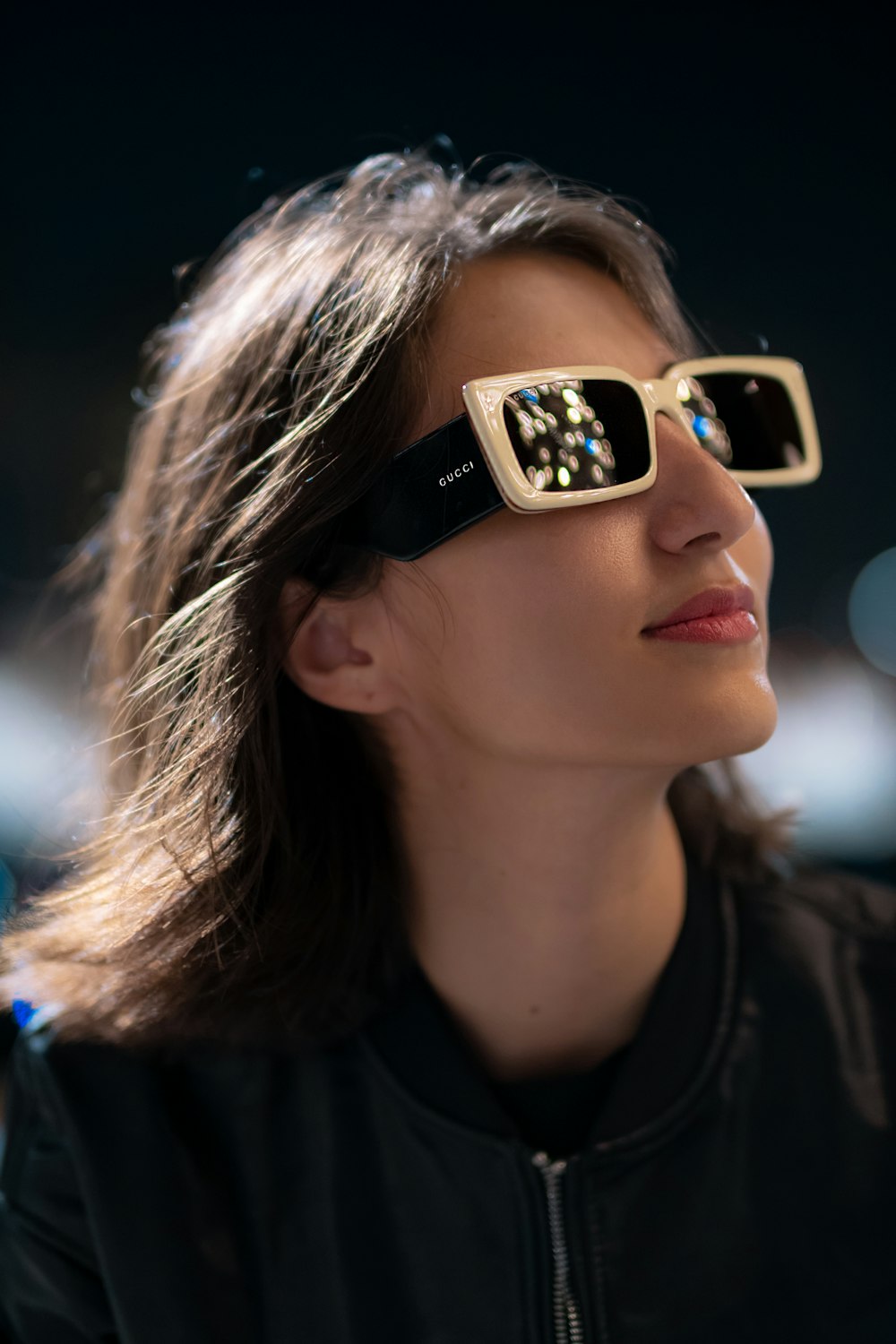 woman wearing gold framed sunglasses