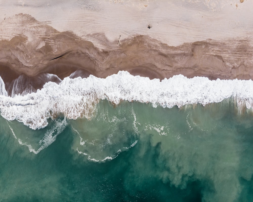 brown and white sea waves