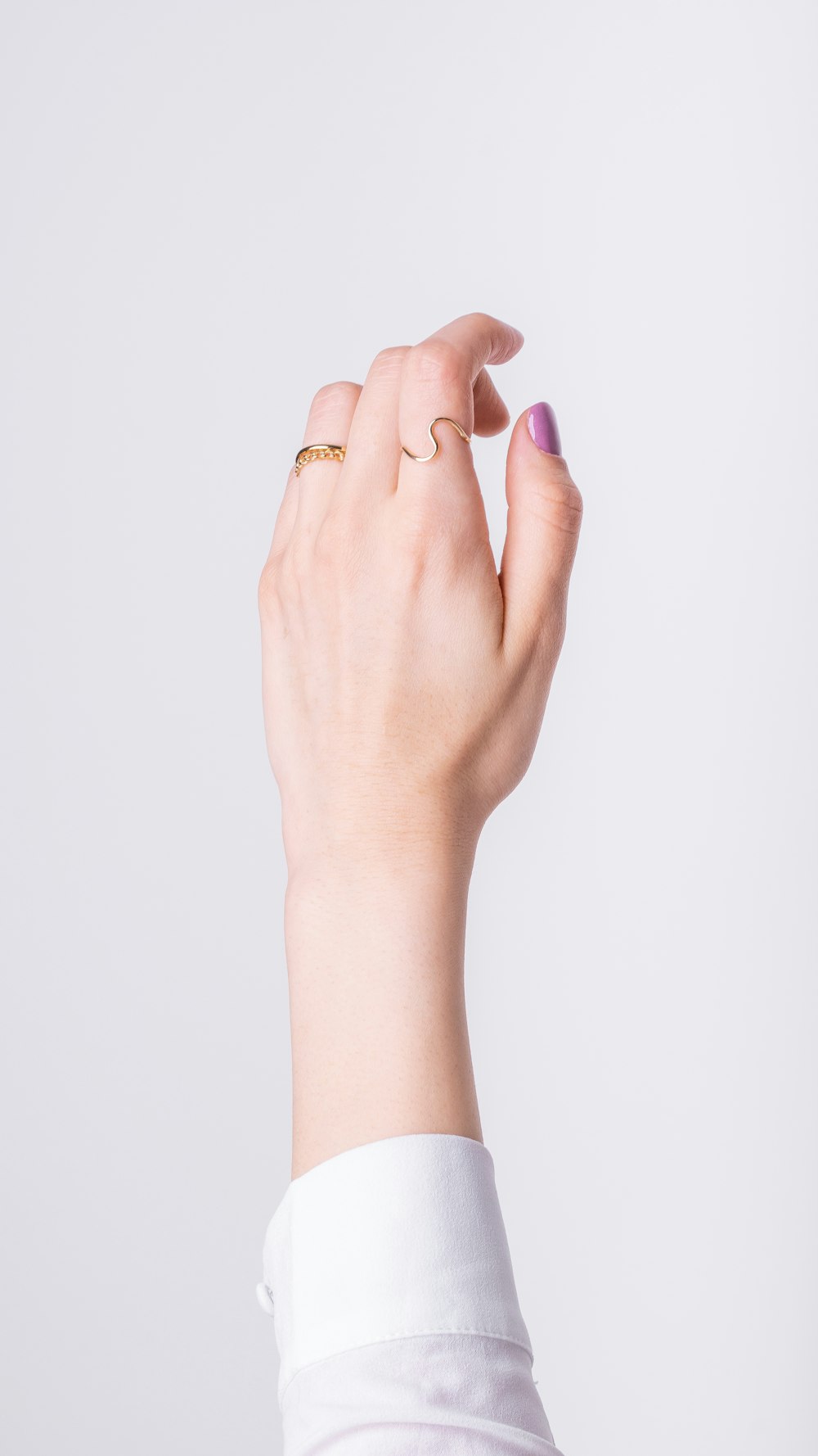 a woman's hand with a ring on it