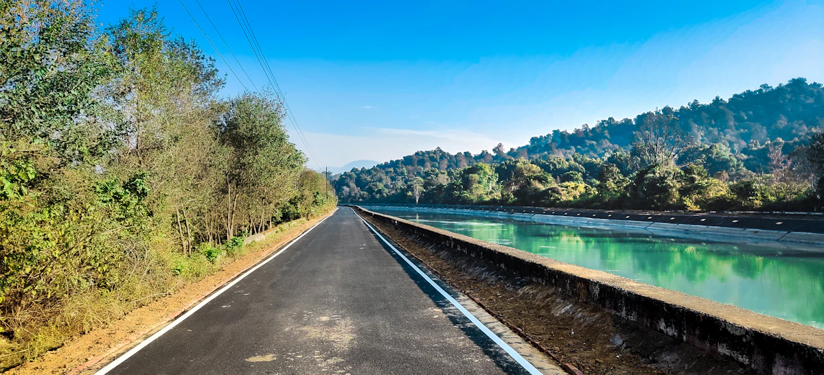 A long road beside a lake