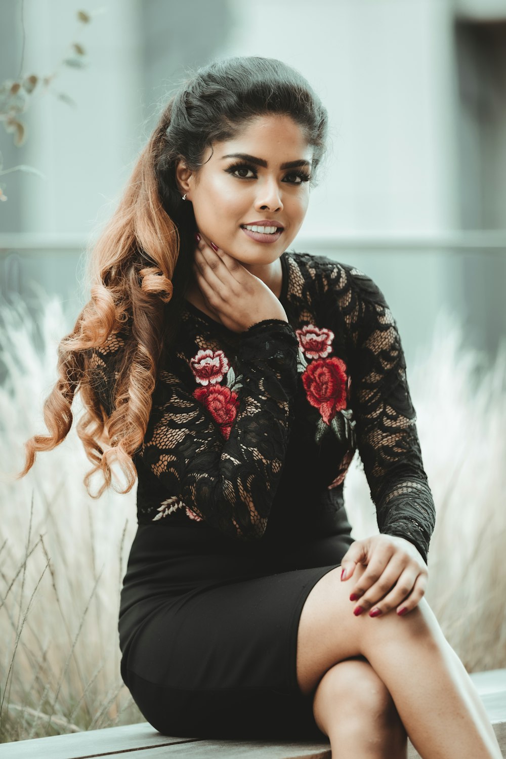 woman in black and red floral long sleeve shirt