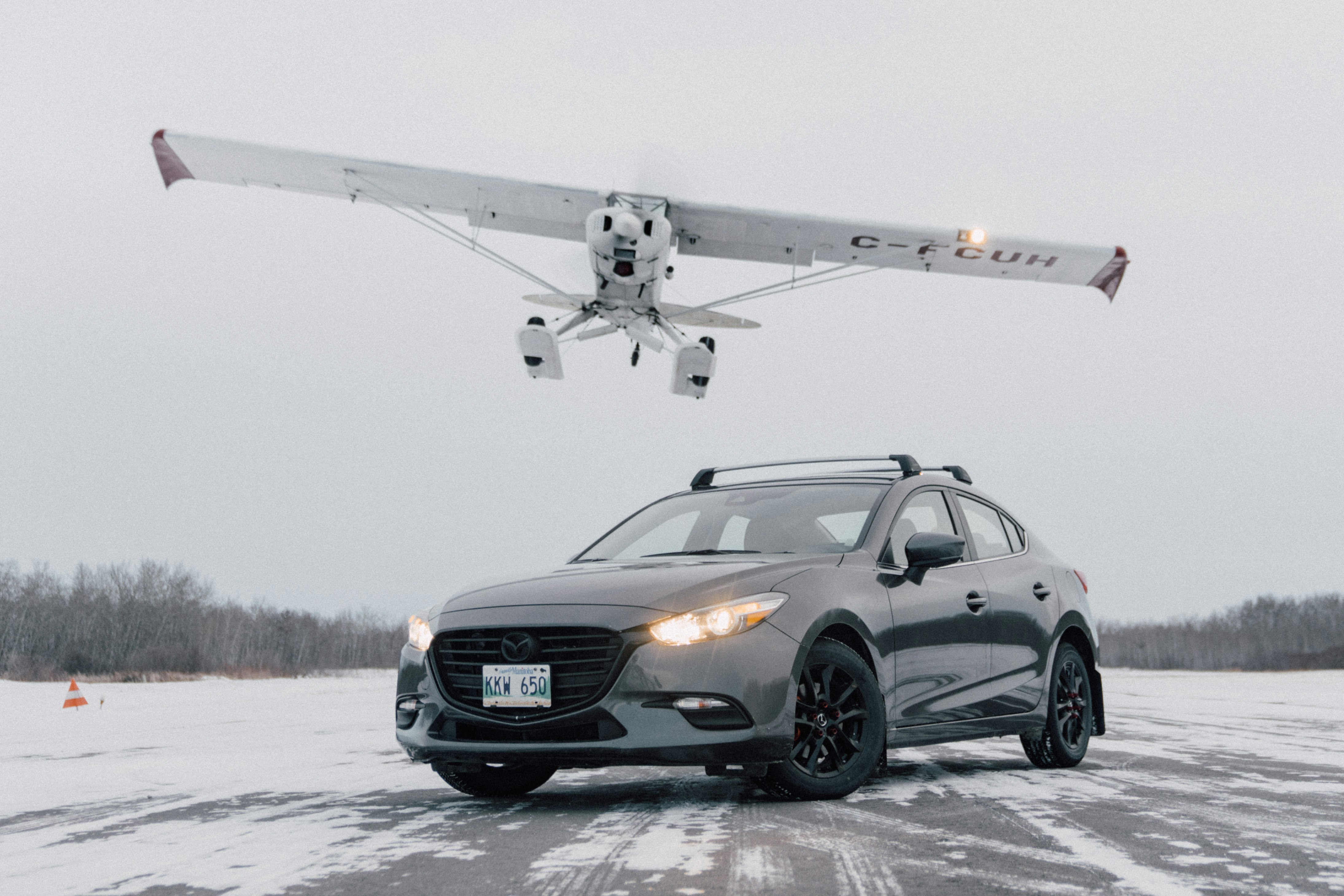 black mercedes benz coupe on snow covered ground during daytime