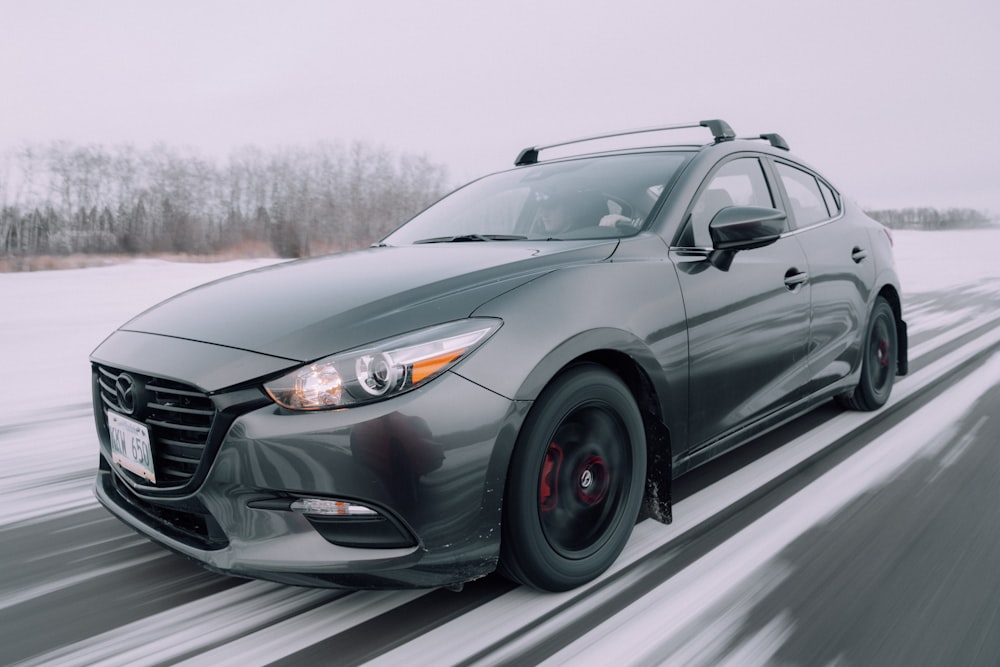 gray mercedes benz coupe on road