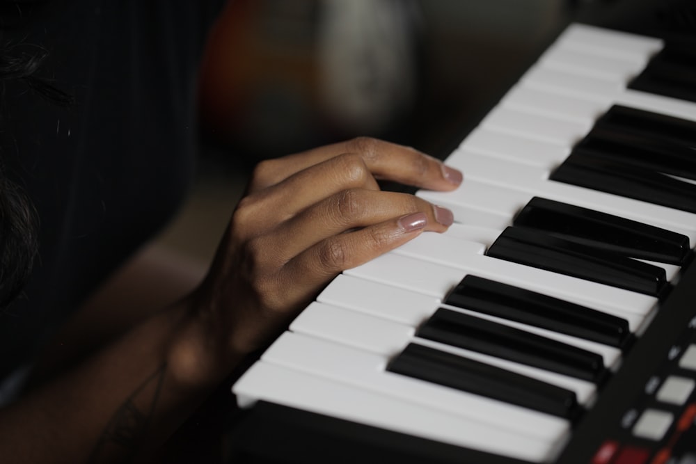 person playing piano during daytime