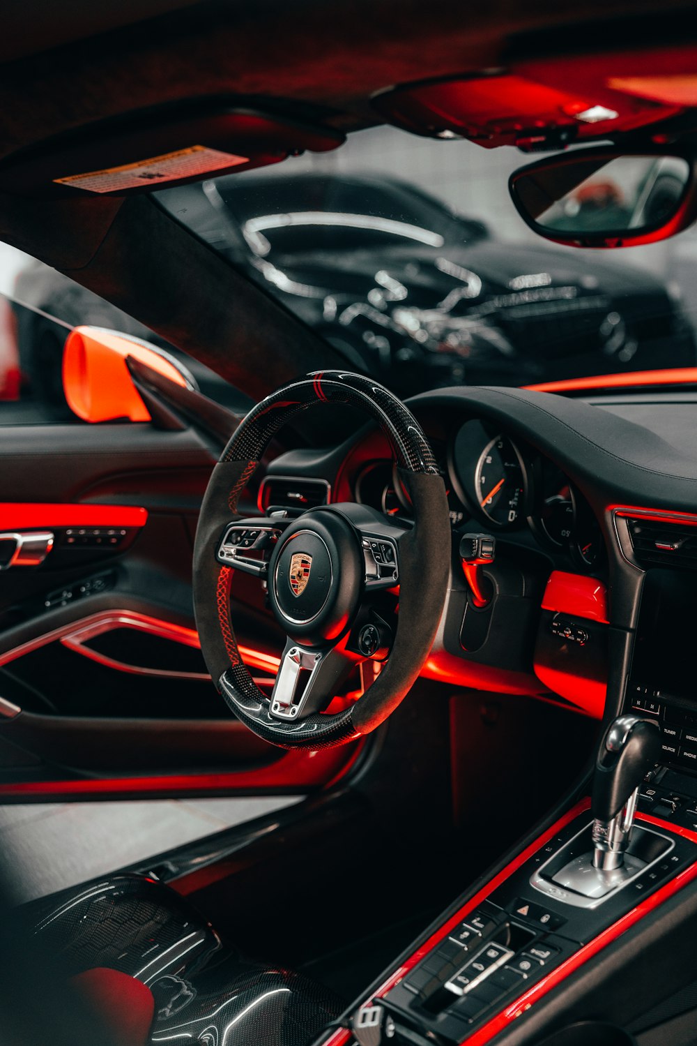 black and red bmw car steering wheel