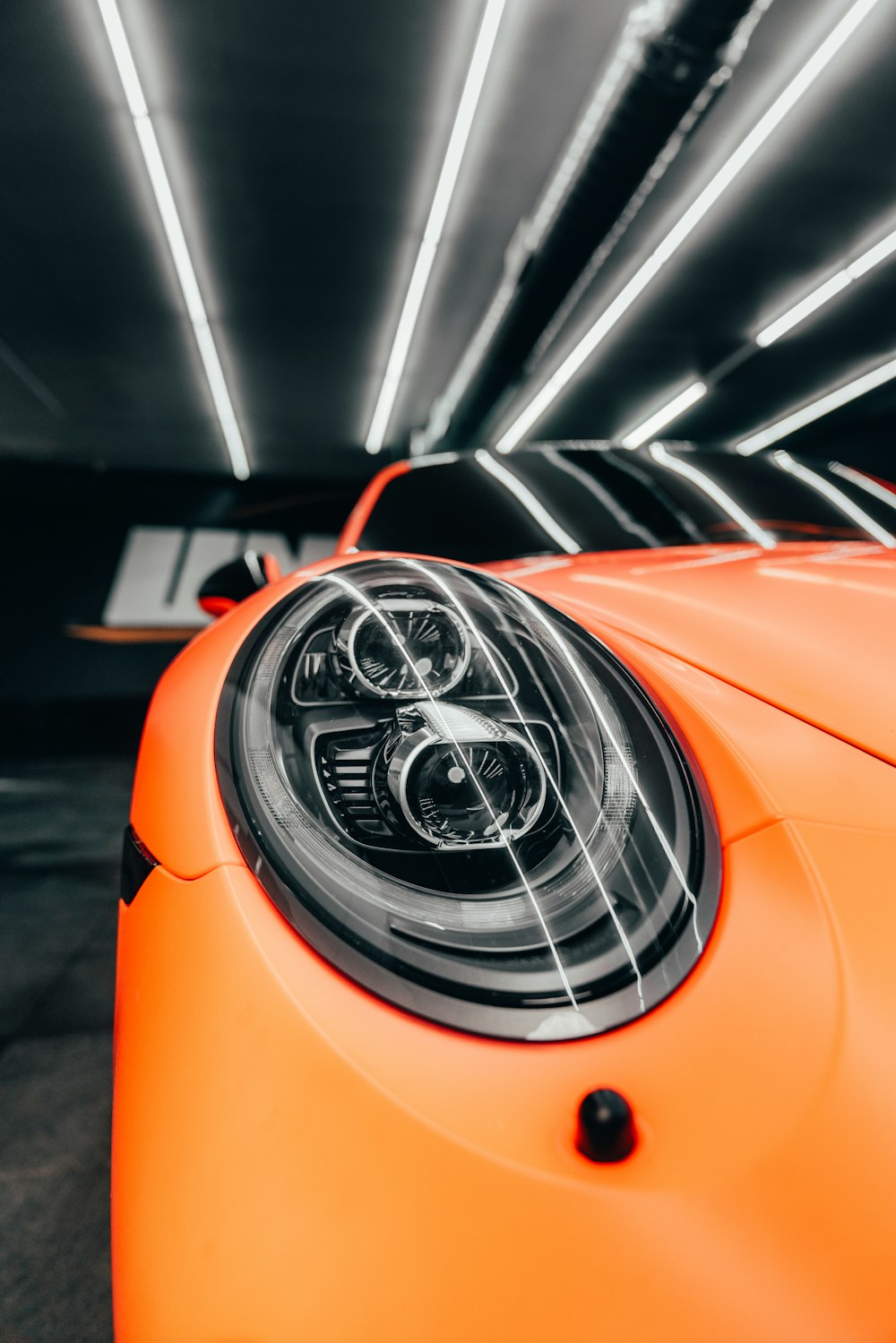 orange and black car in close up photography