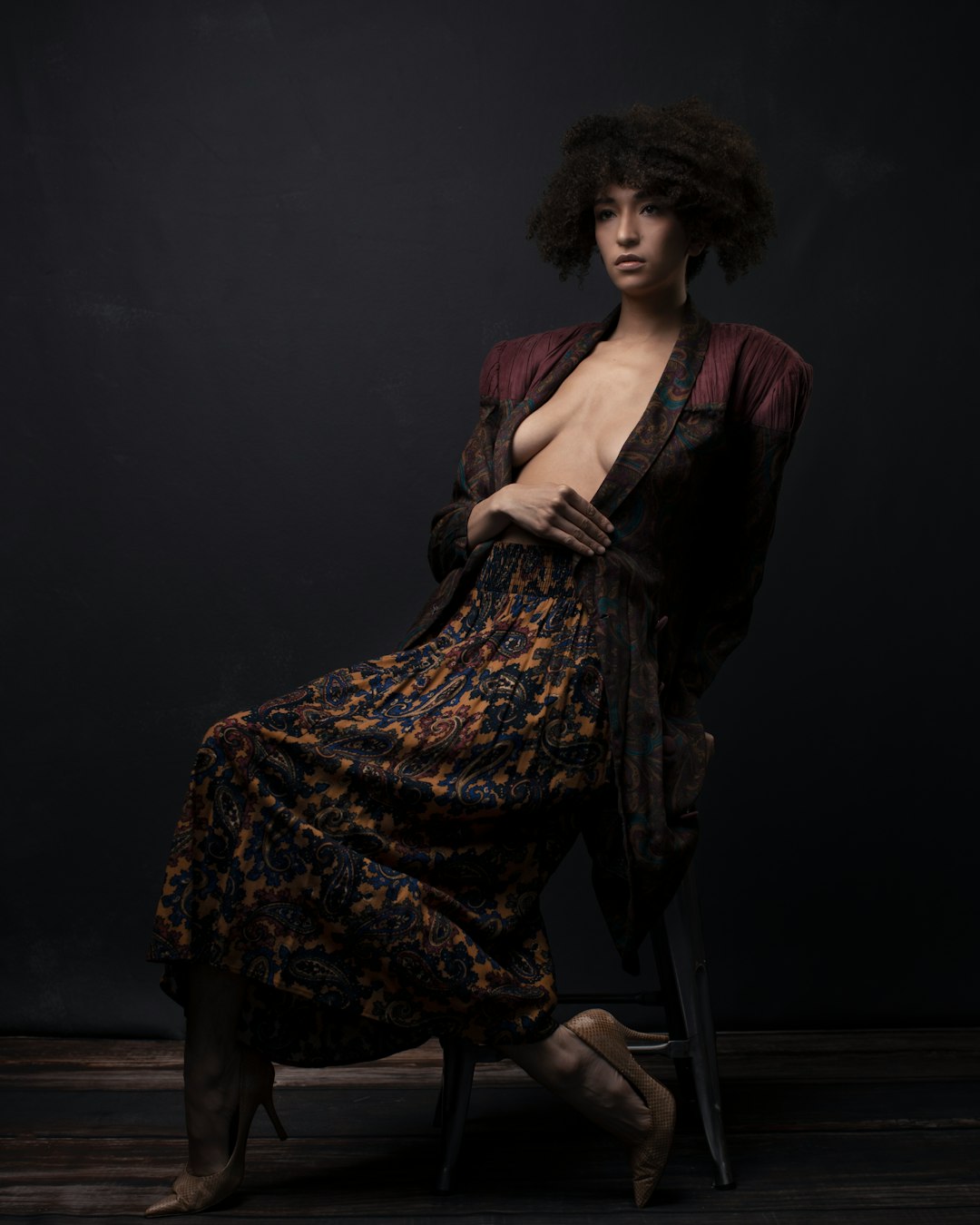 woman in black and brown dress sitting on chair