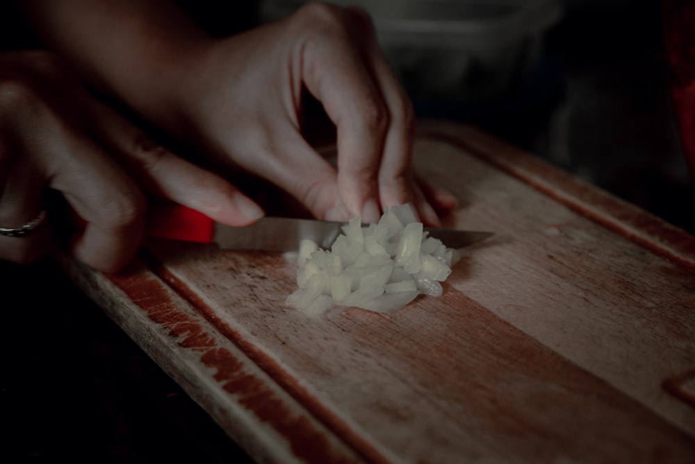 white rice on brown wooden chopping board