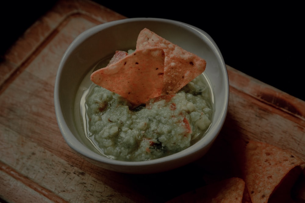 white ceramic bowl with green soup