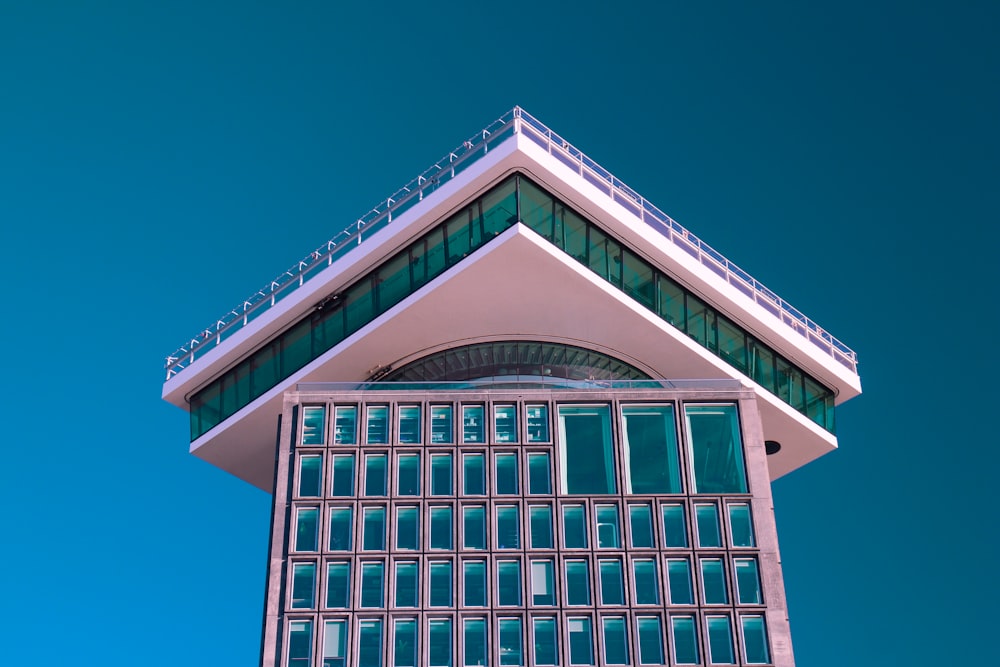 blue and white concrete building under blue sky during daytime