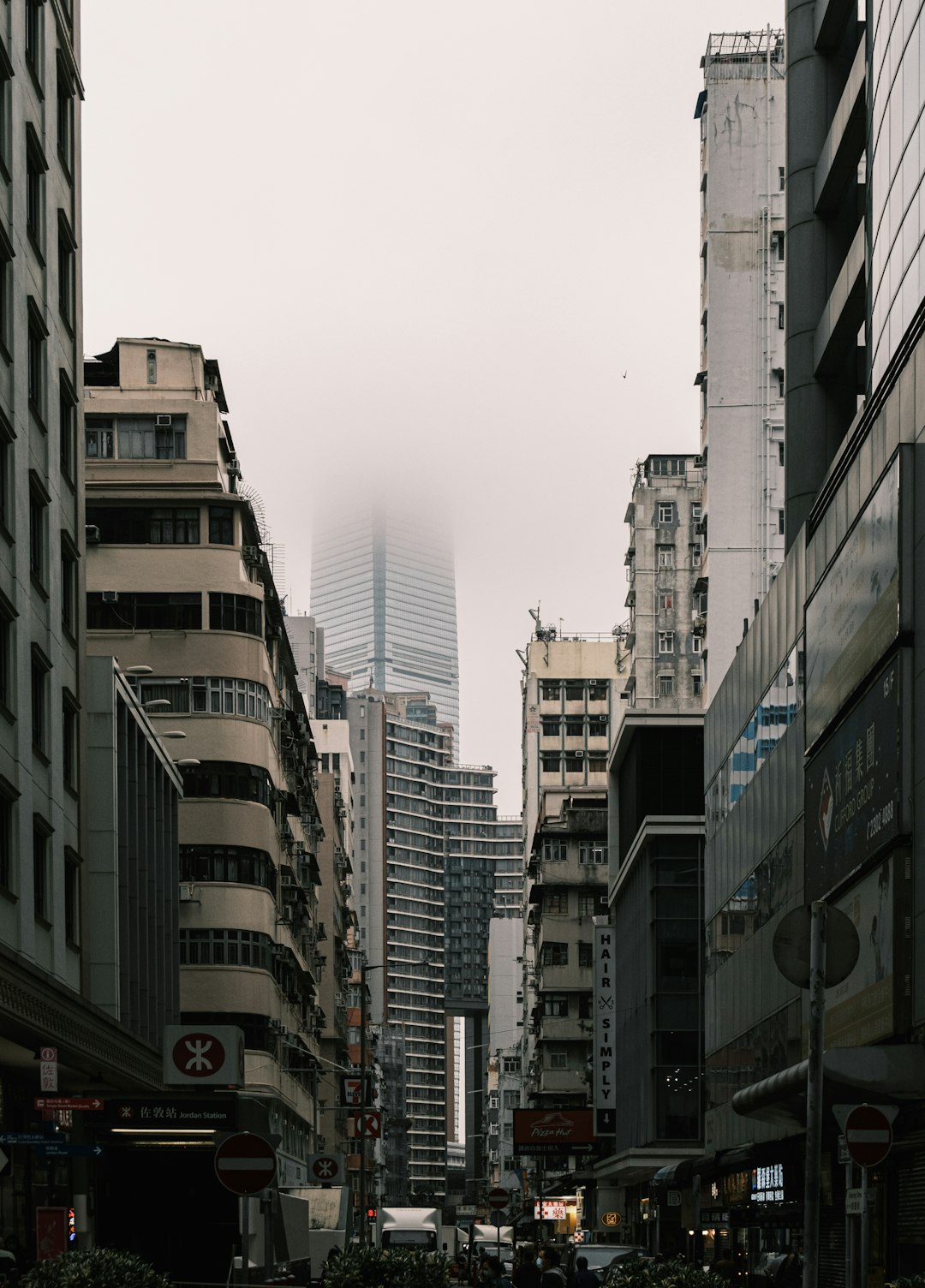 white and brown concrete buildings under white sky during daytime