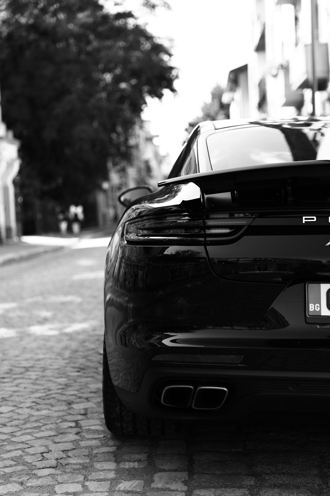 grayscale photo of car on road