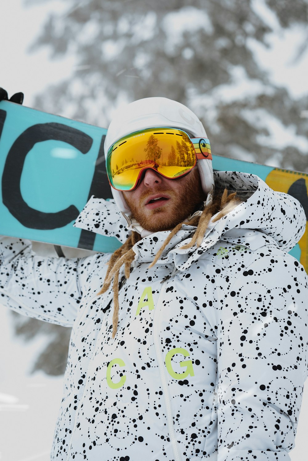 man in white and blue floral shirt wearing white and yellow goggles