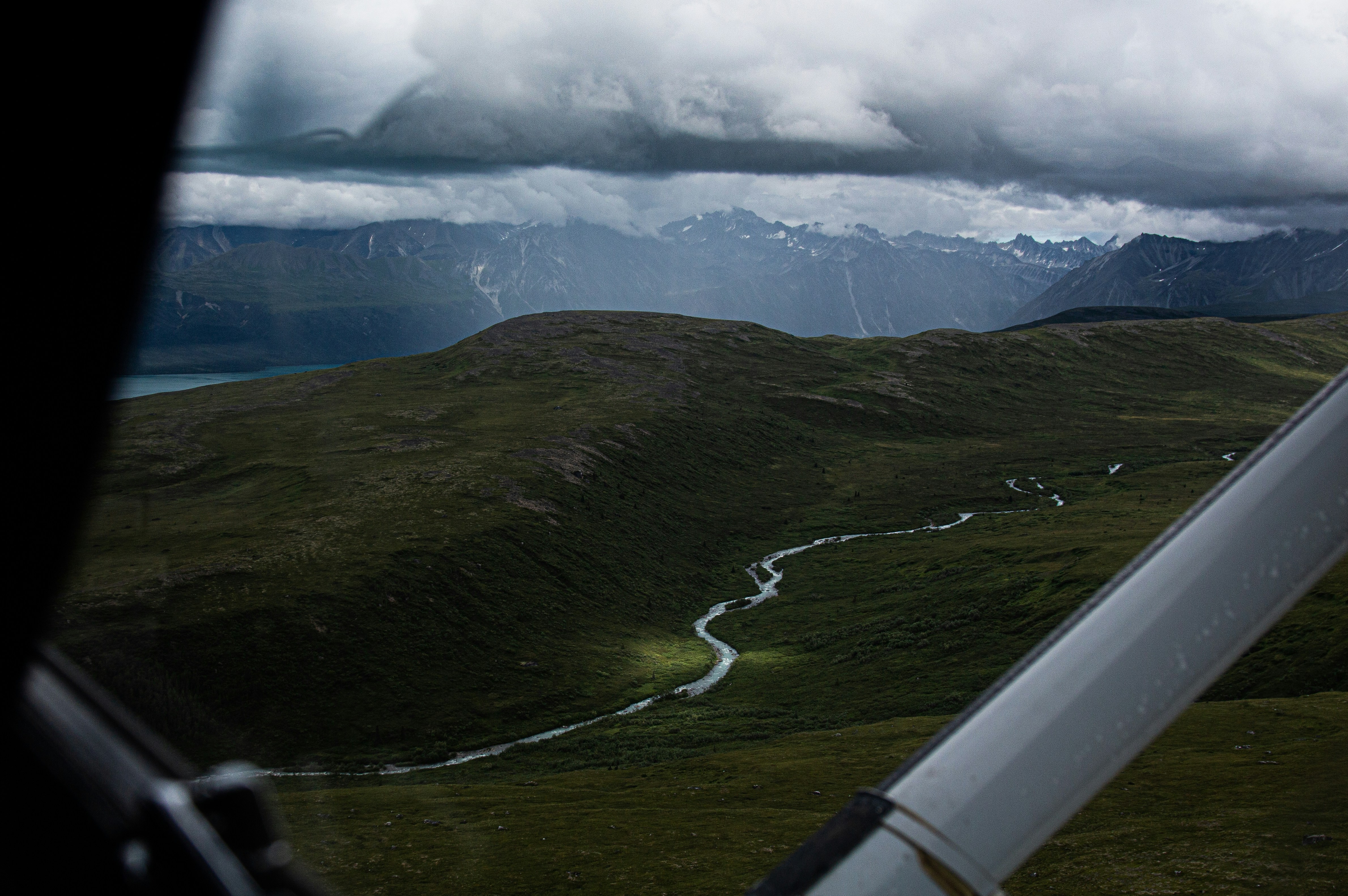 green mountains under white clouds during daytime