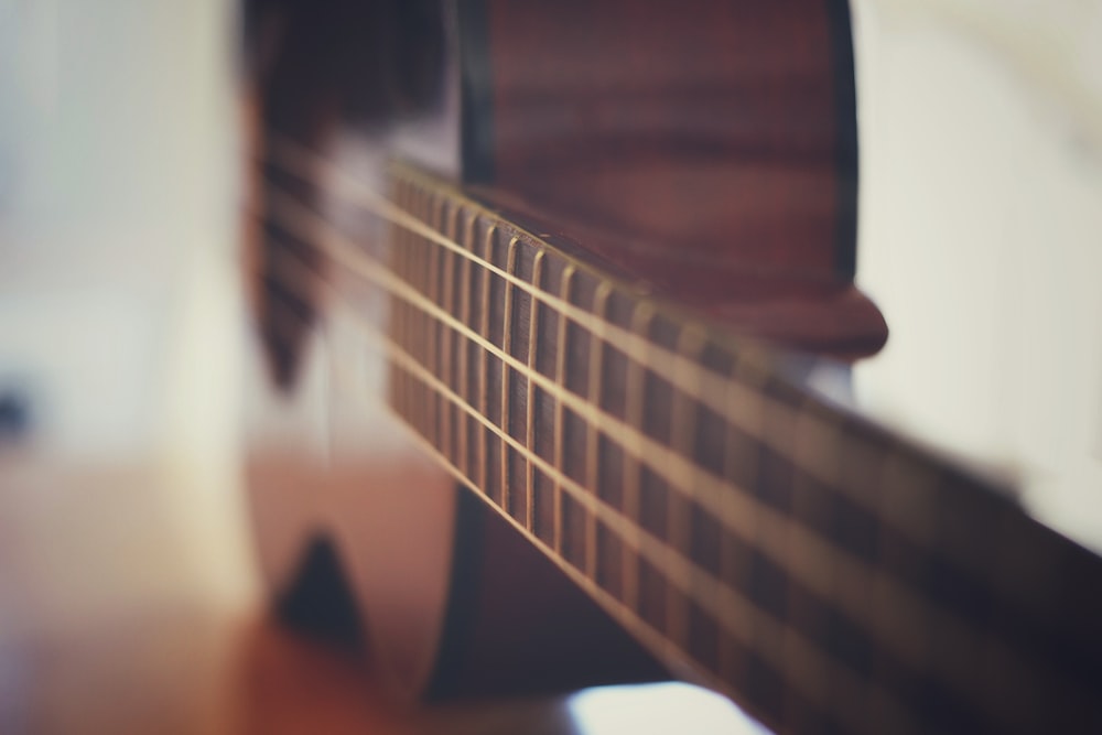 brown and black acoustic guitar