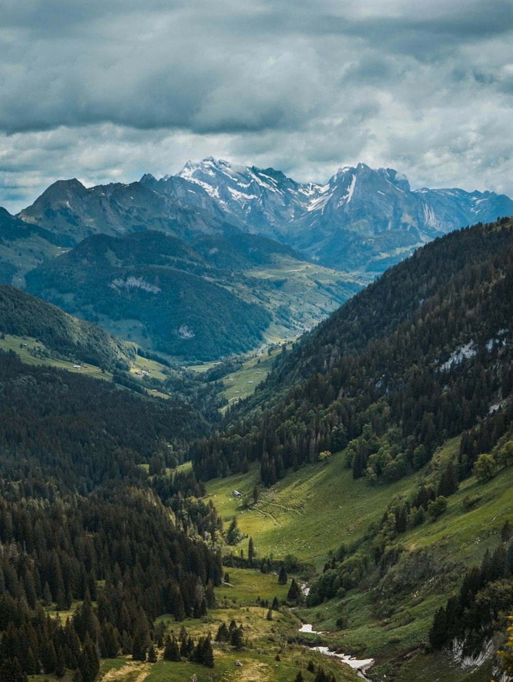 green and brown mountains under white sky during daytime