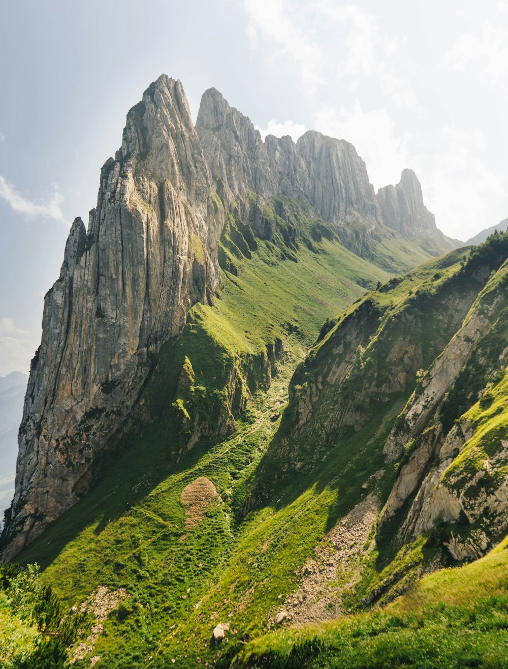 green and brown mountain under blue sky during daytime