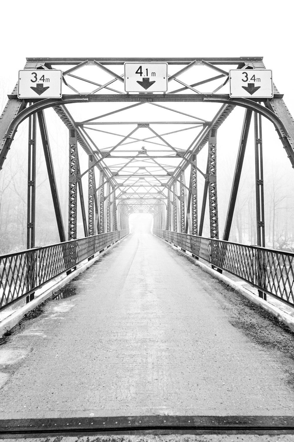 grayscale photo of a bridge