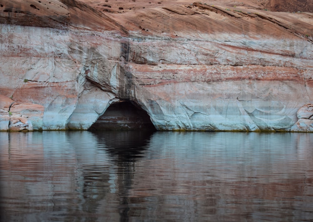 brown rock formation on water