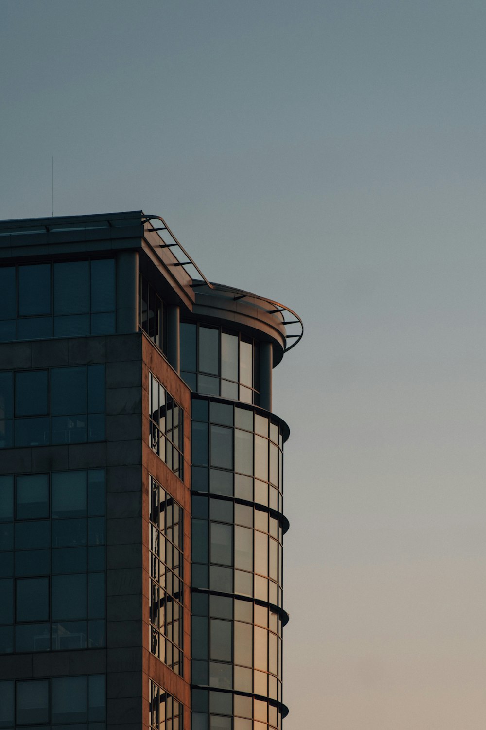 brown and white concrete building under blue sky during daytime