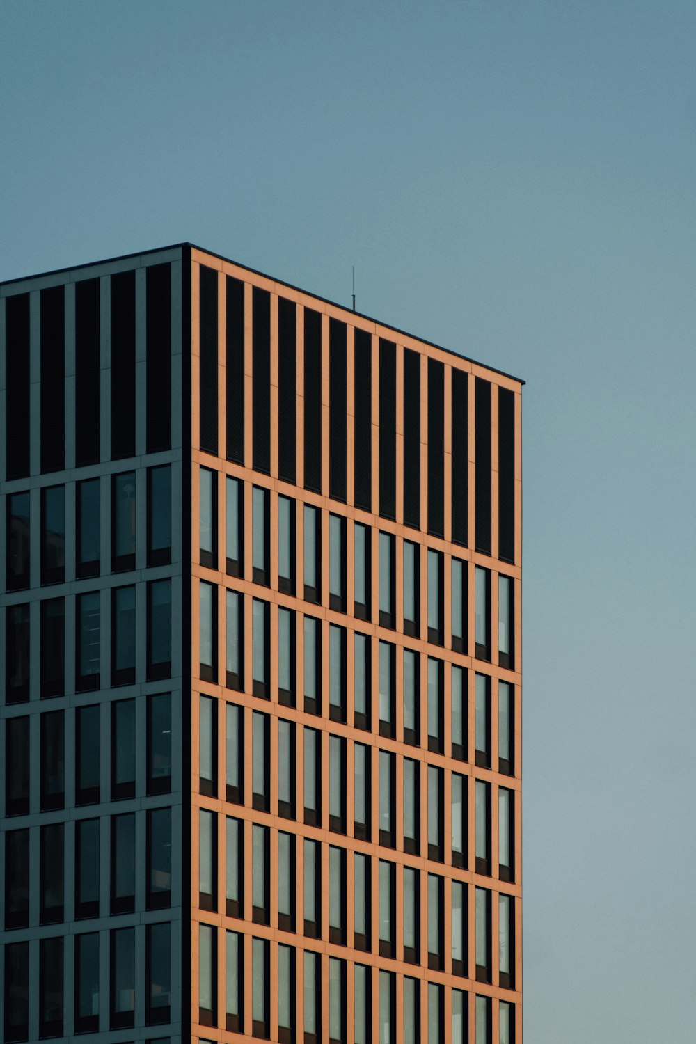 brown concrete building under blue sky during daytime