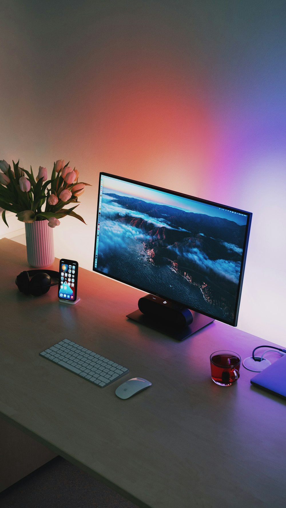 black flat screen computer monitor beside black and gray remote control