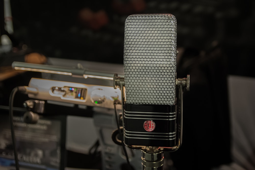 black and silver microphone on black microphone stand