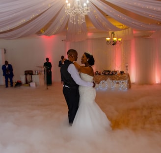 bride and groom dancing on stage