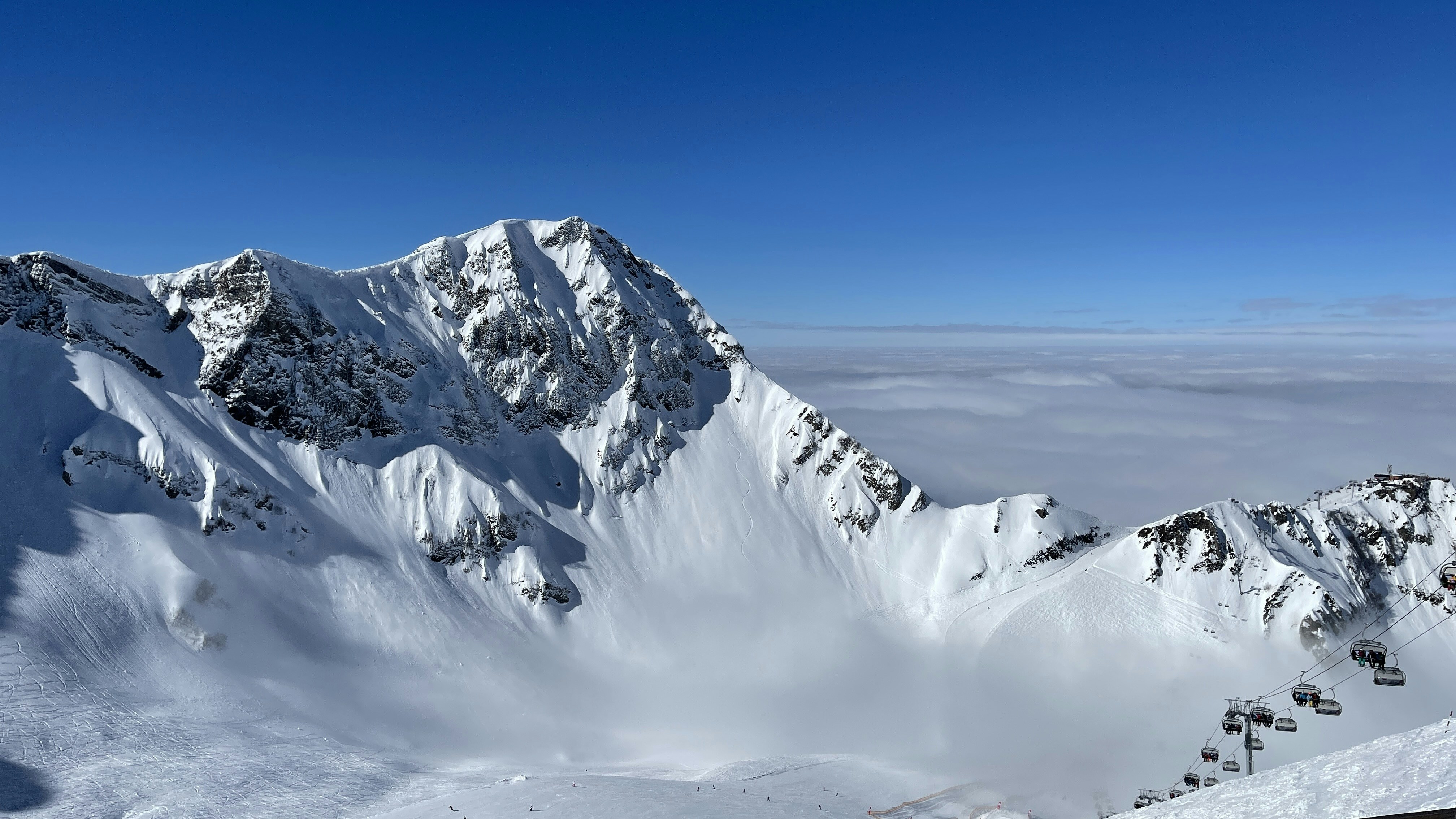 snow covered mountain under blue sky during daytime