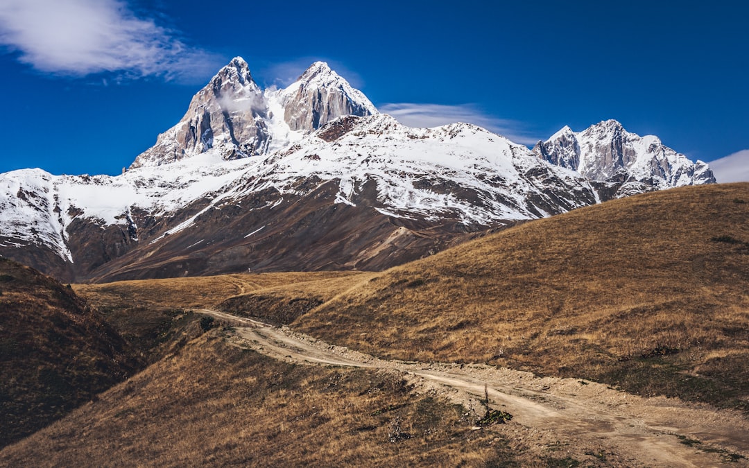 snow covered mountain under blue sky during daytime