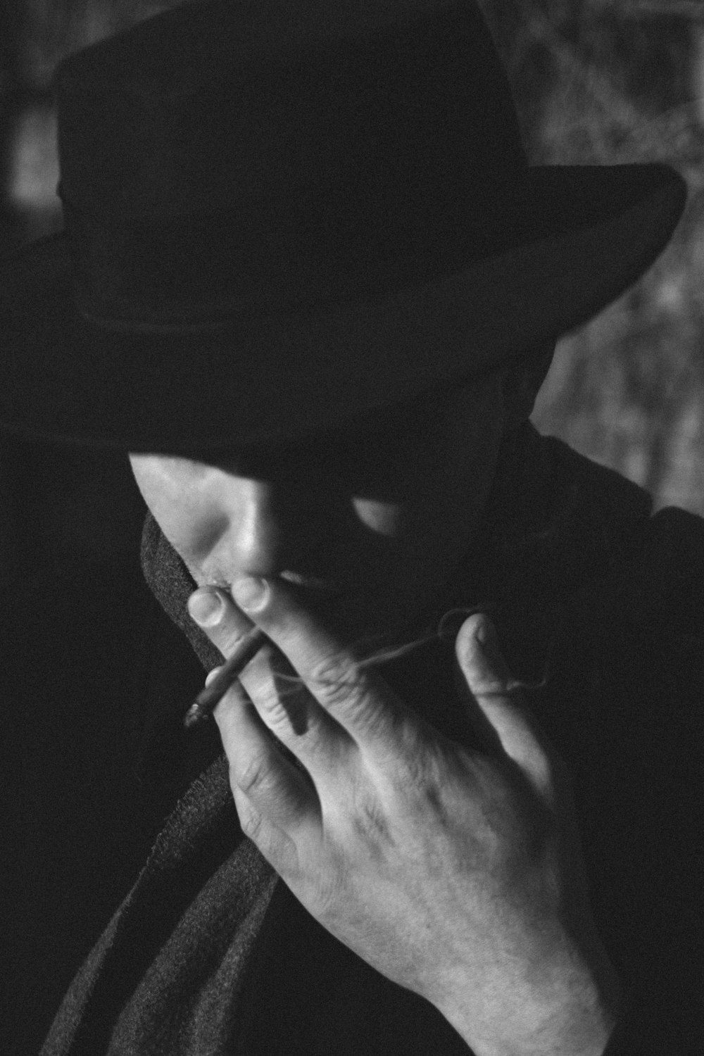 grayscale photo of person wearing hat