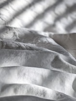 white and gray stripe textile