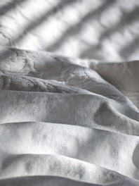 white and gray stripe textile