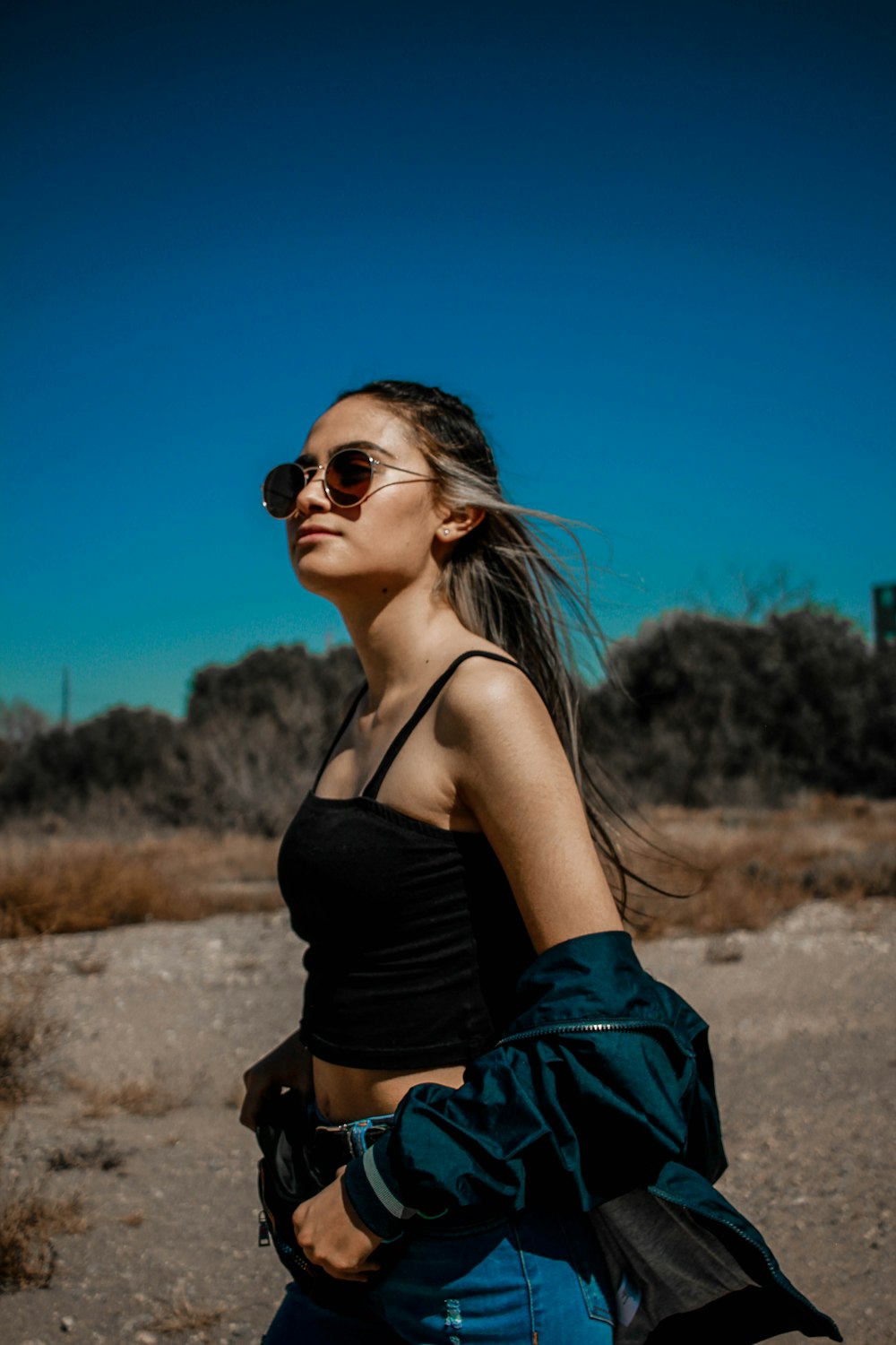 woman in black tank top wearing black sunglasses