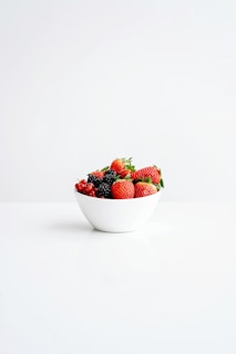 strawberries in white ceramic bowl
