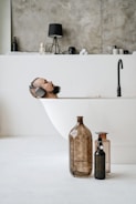 brown glass bottle on white table