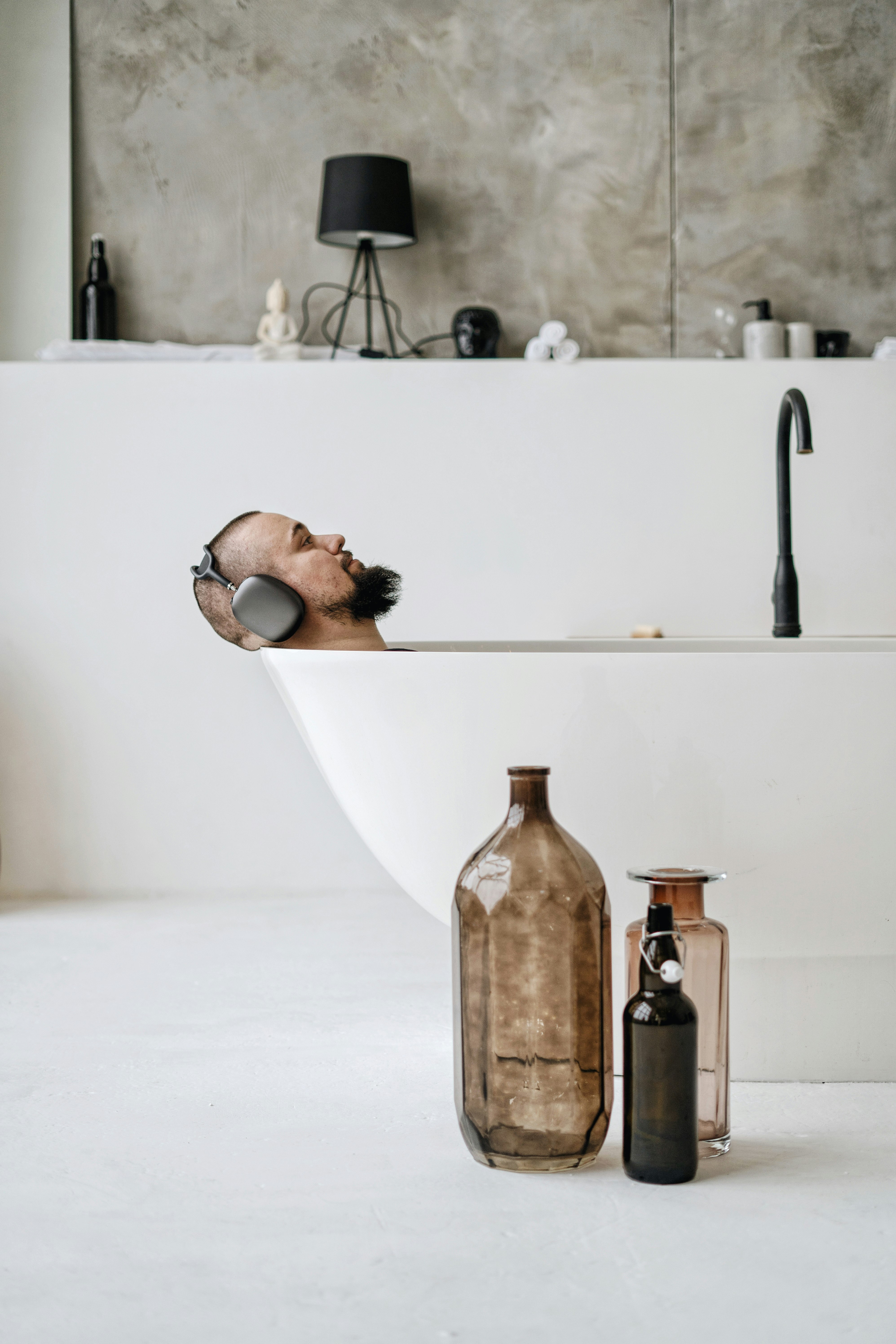 brown glass bottle on white table