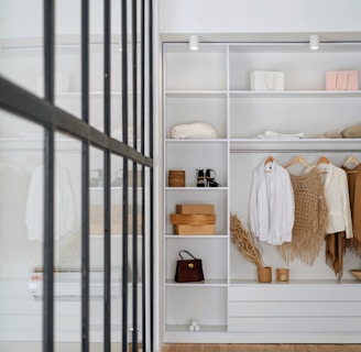 white bath towel on white wooden cabinet