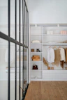 white bath towel on white wooden cabinet