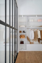 white bath towel on white wooden cabinet