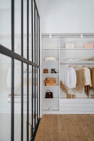 white bath towel on white wooden cabinet