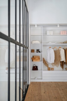 white bath towel on white wooden cabinet